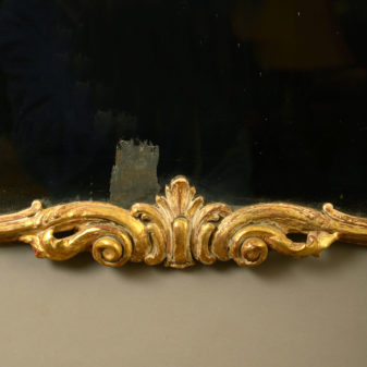 A mid-18th century irish george iii carved giltwood mirror