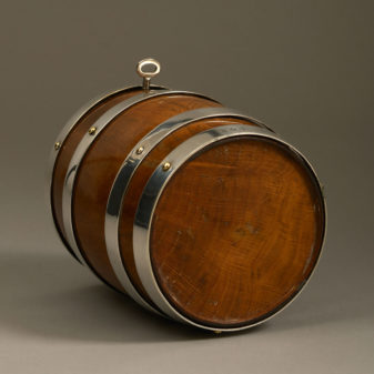 A 19th century oak and silvered barrel tobacco jar