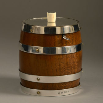A 19th Century Oak and Silvered Barrel Tobacco Jar