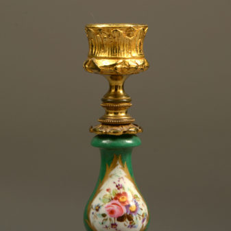 A 19th century pair of sevres and ormolu candlesticks
