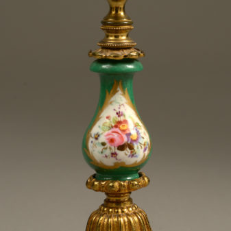 A 19th century pair of sevres and ormolu candlesticks