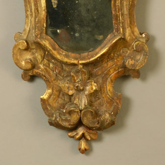 A pair of 18th century venetian giltwood girandole mirrors