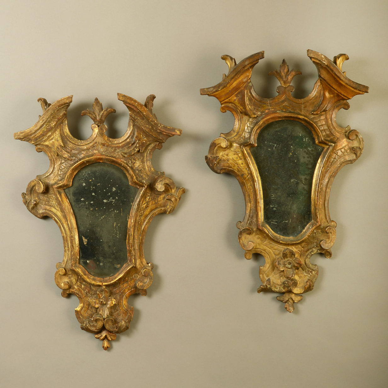 A pair of 18th century venetian giltwood girandole mirrors