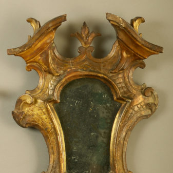 A pair of 18th century venetian giltwood girandole mirrors