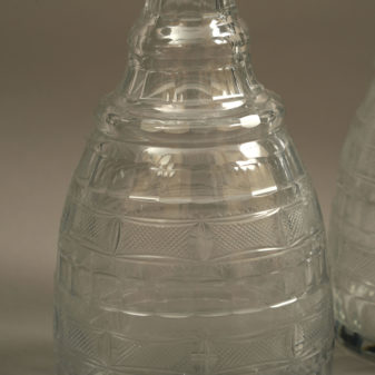 A pair of regency period cut glass decanters