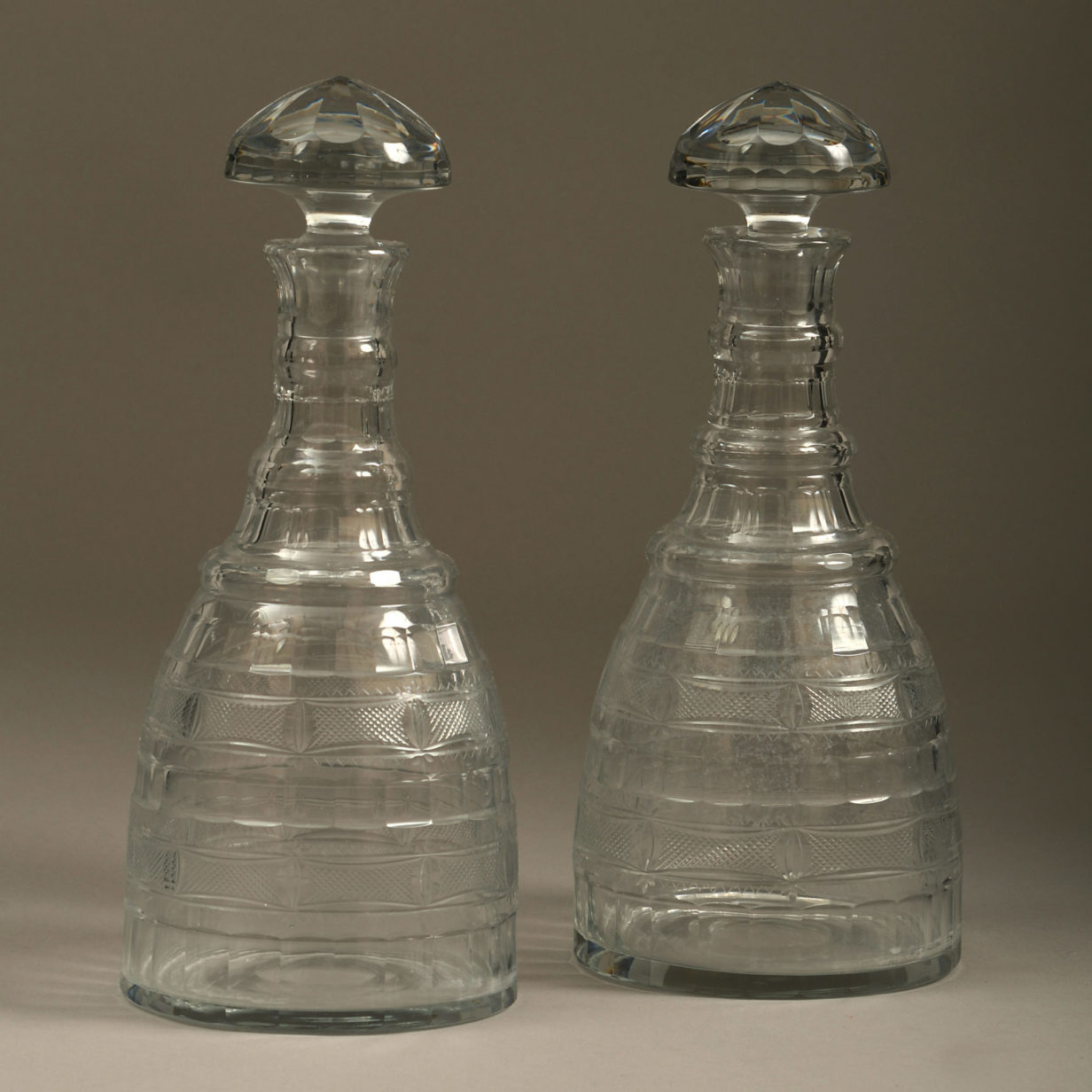 A pair of regency period cut glass decanters