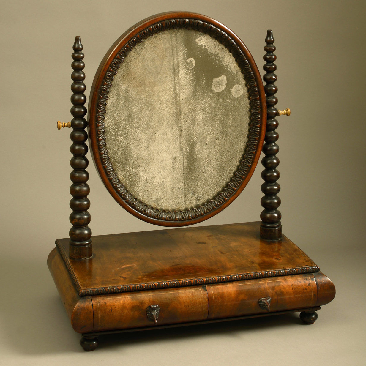 A mid-19th century victorian walnut dressing table mirror