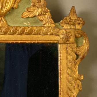 An early 20th century painted parcel gilded mirror in the louis xvi manner