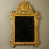 An early 20th century painted parcel gilded mirror in the louis xvi manner