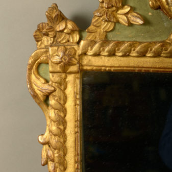An early 20th century painted parcel gilded mirror in the louis xvi manner