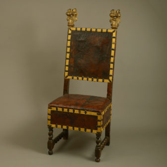 A 17th century florentine parcel gilded walnut chair
