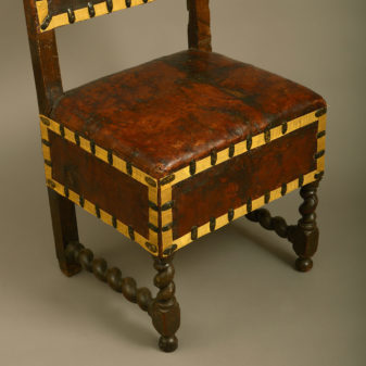 A 17th century florentine parcel gilded walnut chair