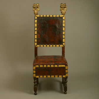 A 17th century florentine parcel gilded walnut chair