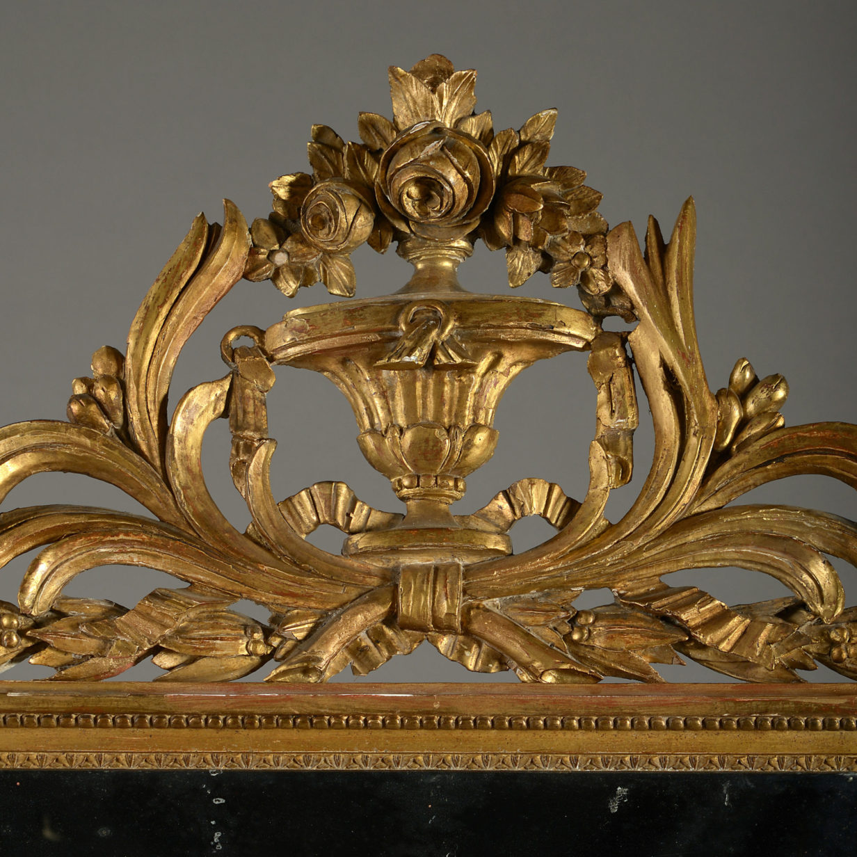 A large late 18th century louis xvi period giltwood mirror