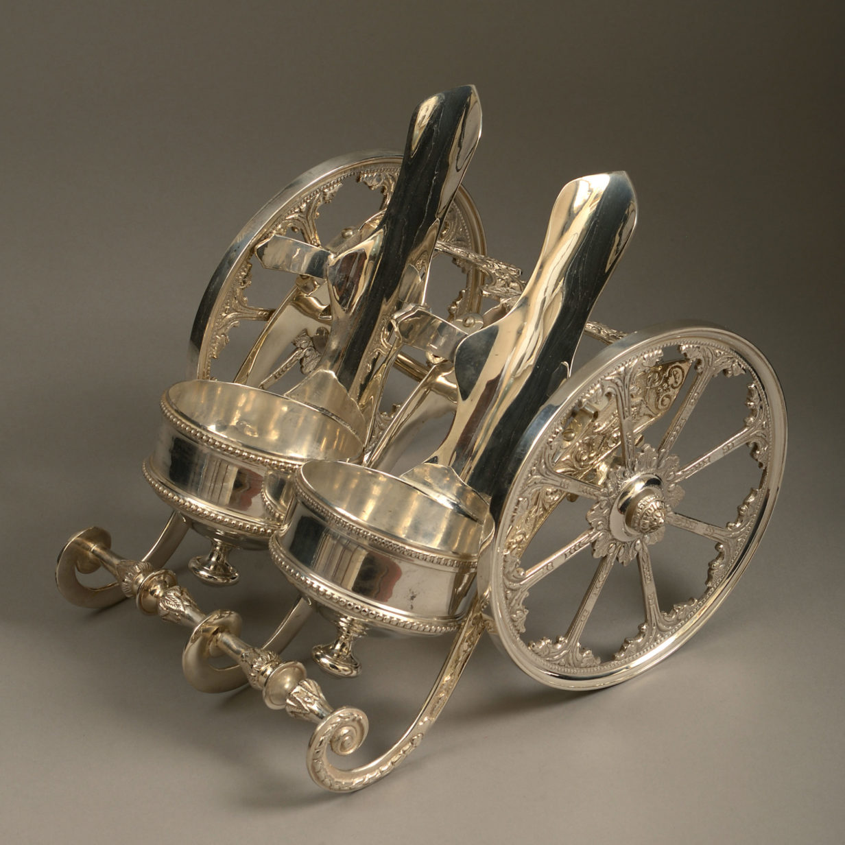 A mid-20th century silvered champagne bottle carriage
