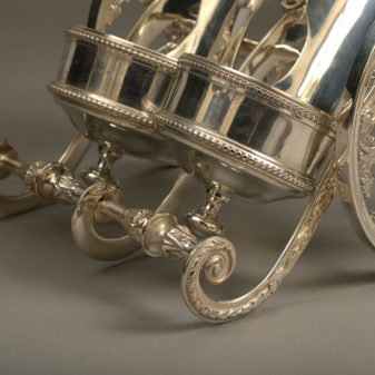 A mid-20th century silvered champagne bottle carriage