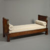 An early 19th century empire period mahogany day bed