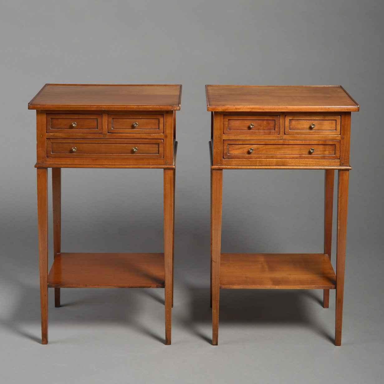 A pair of bedside tables in the directoire manner