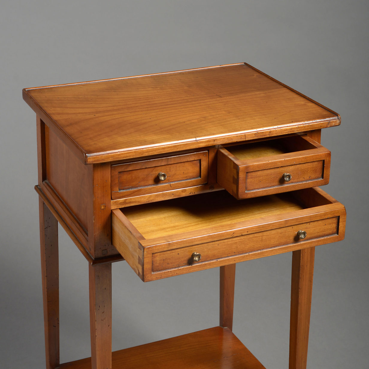 A pair of bedside tables in the directoire manner