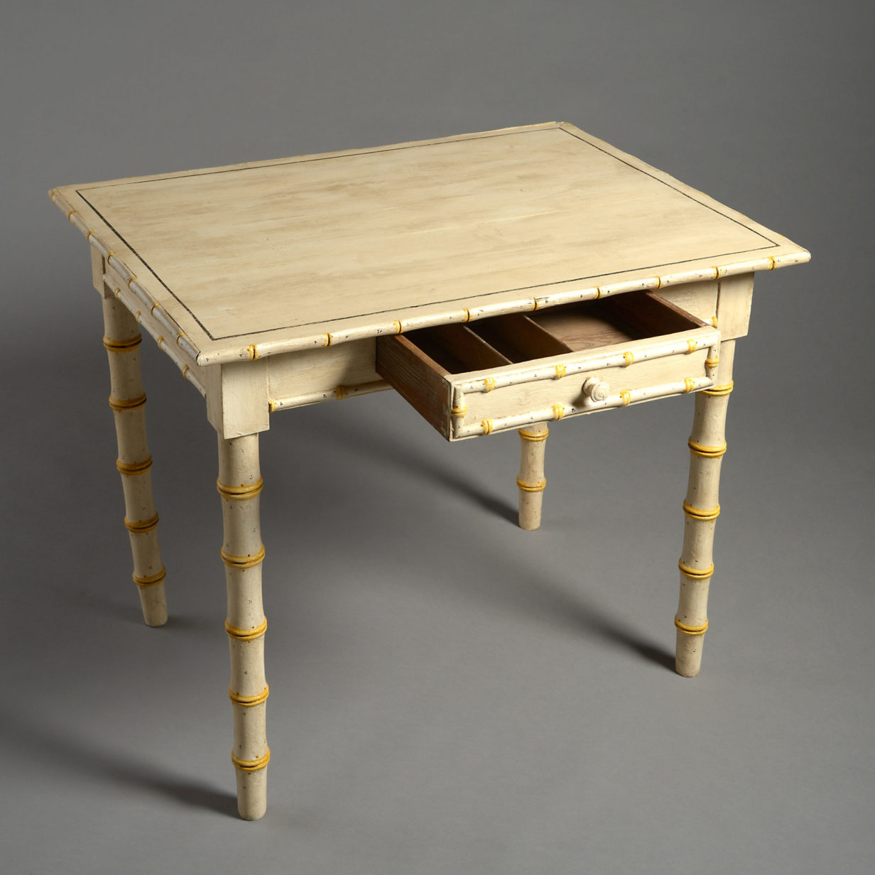 A 19th century faux bamboo side table