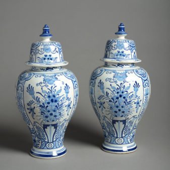 A 19th century pair of blue and white delft vases