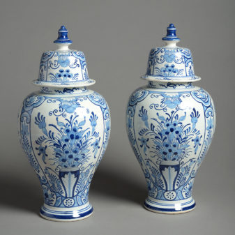 A 19th century pair of blue and white delft vases