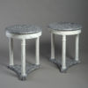 A pair of faux marble circular end tables