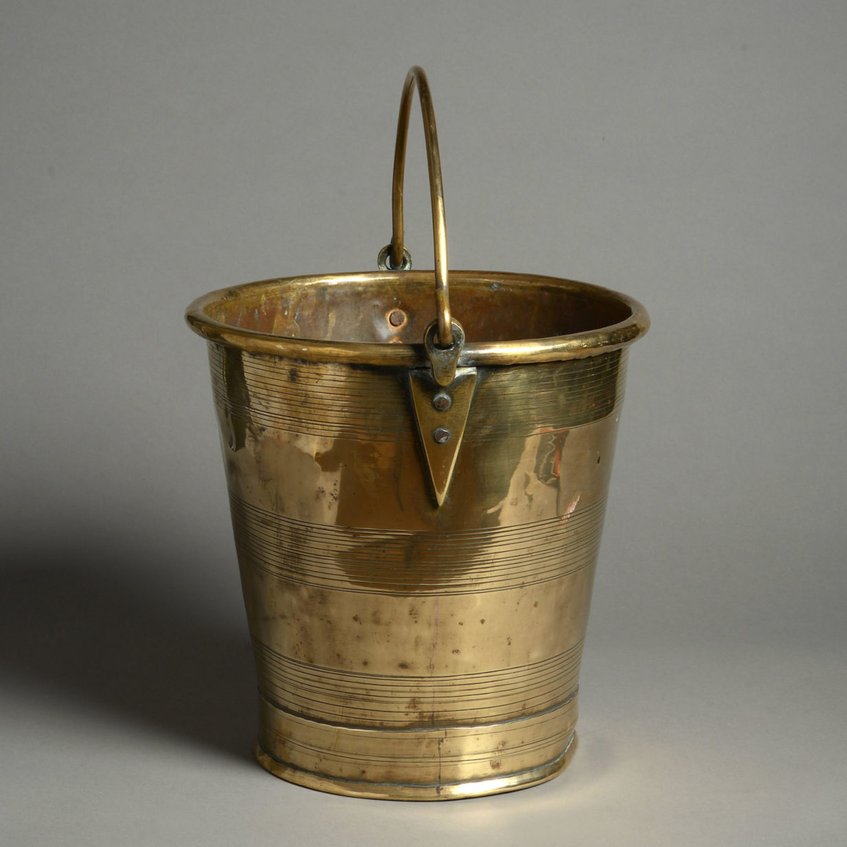 A 19th century turned brass fire bucket