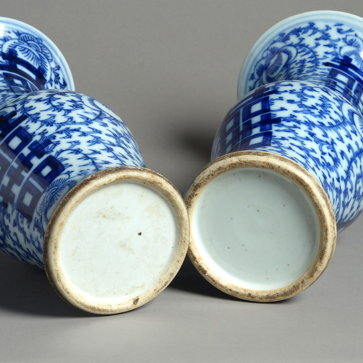 A 19th century pair of blue and white porcelain trumpet vases