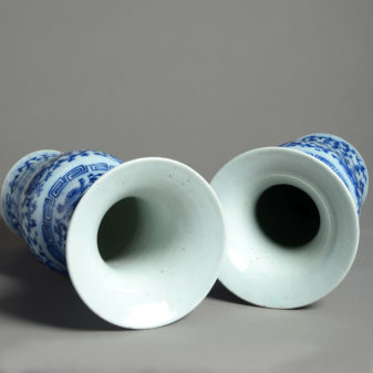 A 19th century pair of blue and white porcelain trumpet vases