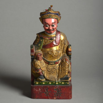 A 19th century carved gilded deity