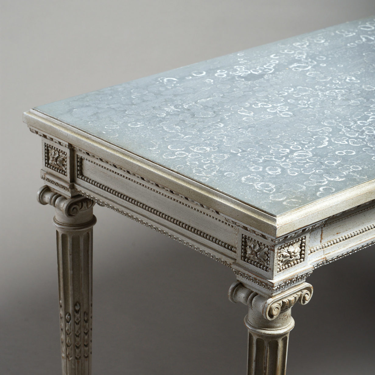 A 19th century carved painted louis xvi style side table