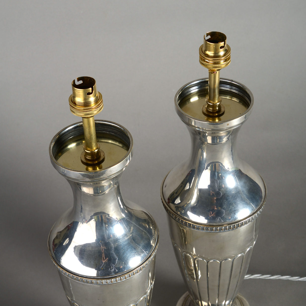 Early 20th century pair of silvered vase lamps