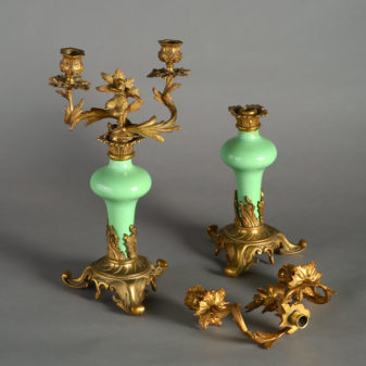 A pair of 19th century rococo porcelain and ormolu candelabra