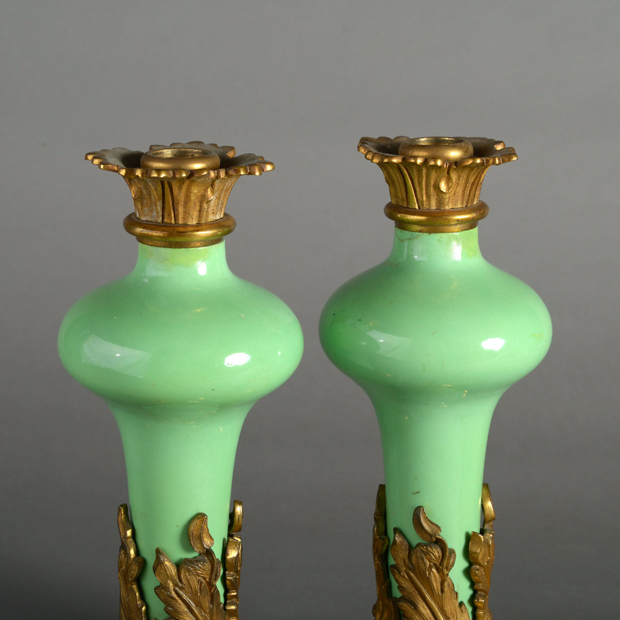 A pair of 19th century rococo porcelain and ormolu candelabra