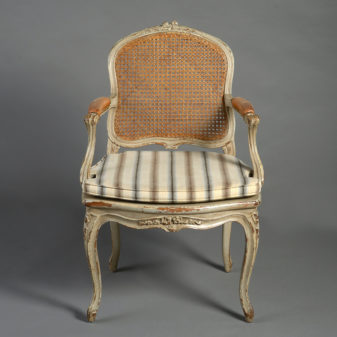 A pair of 19th century rococo revival armchairs in the louis xv taste