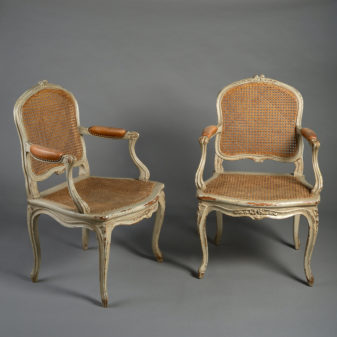 A pair of 19th century rococo revival armchairs in the louis xv taste