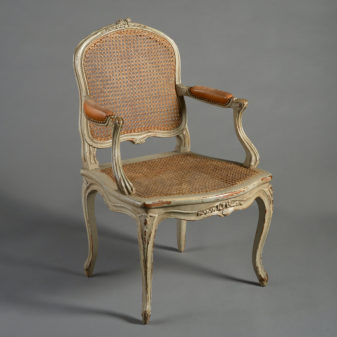 A pair of 19th century rococo revival armchairs in the louis xv taste