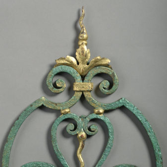 Mid-century patinated and gilt iron wall light after gilbert poillerat