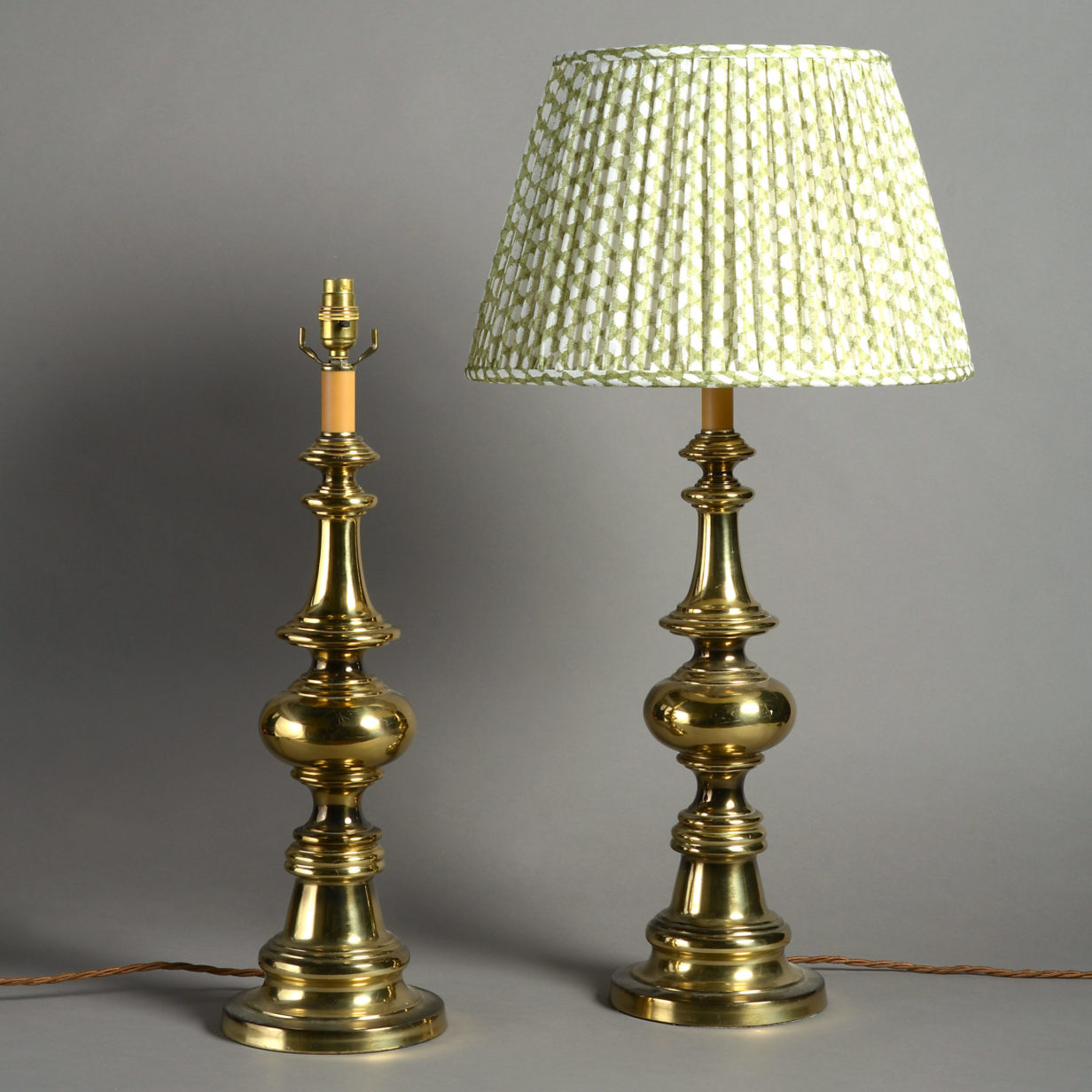 A large pair of mid 20th century brass table lamps