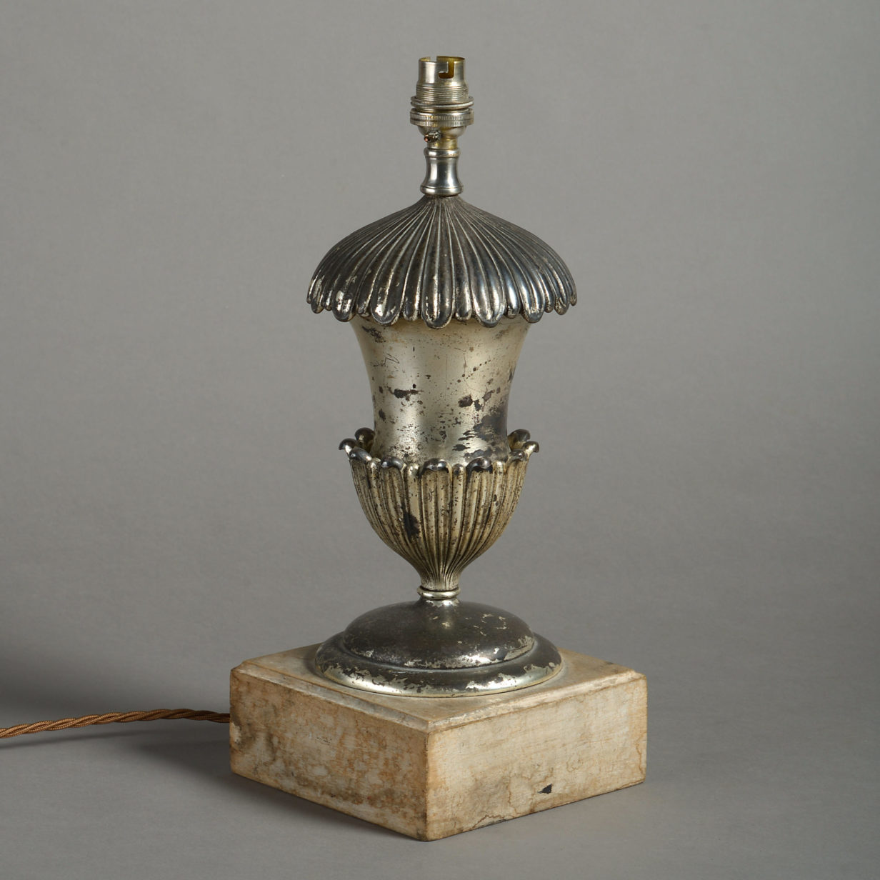 A late 19th century silvered urn base