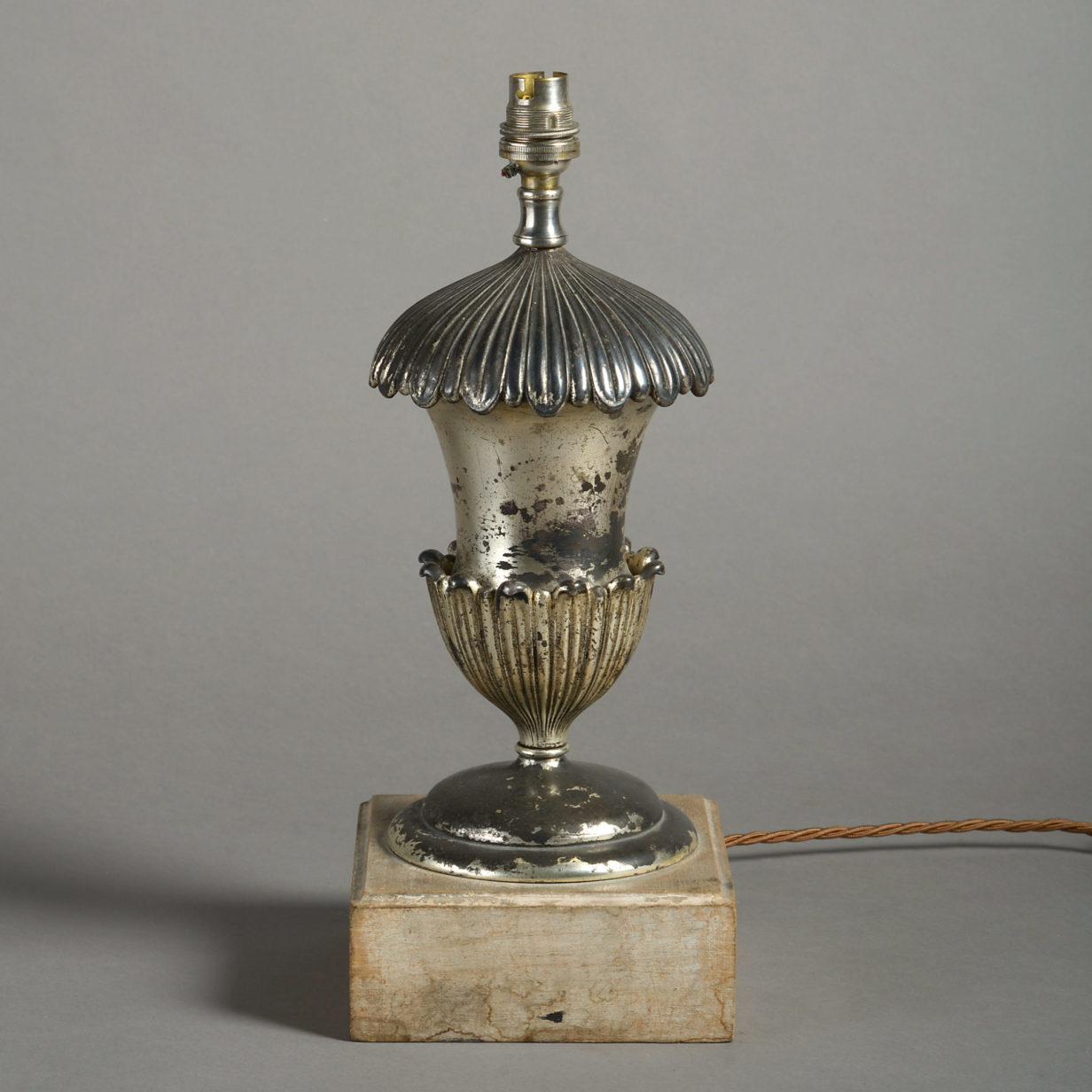A late 19th century silvered urn base