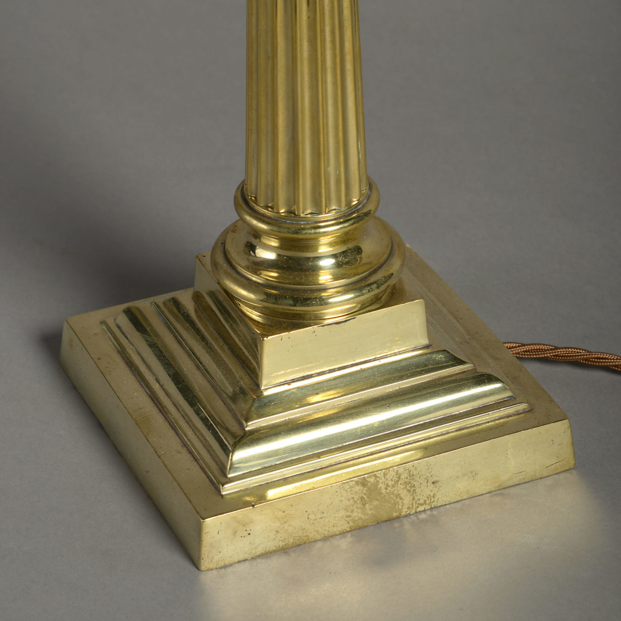A late 19th century brass column lamp base