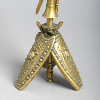A pair of brass classical trophy candlesticks