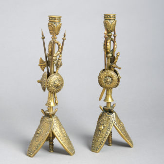 A pair of brass classical trophy candlesticks