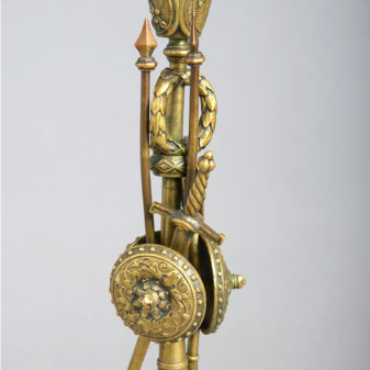 A pair of brass classical trophy candlesticks