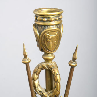 A pair of brass classical trophy candlesticks