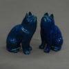 A pair of turquoise porcelain cats