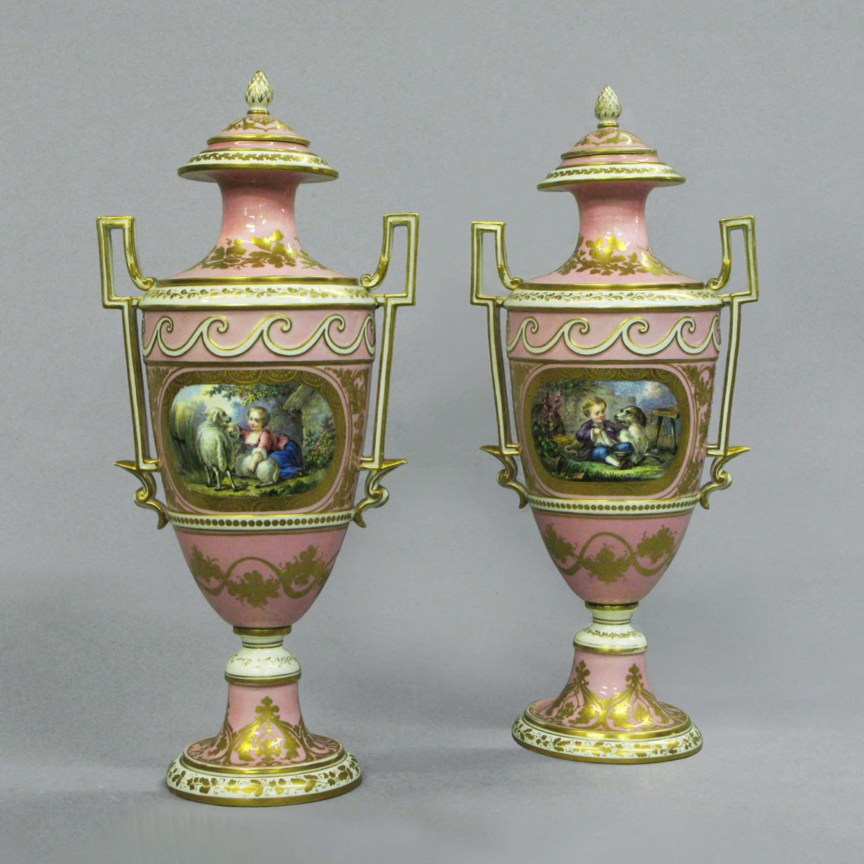 A Pair of Sevres Pink Ground Vases & Covers