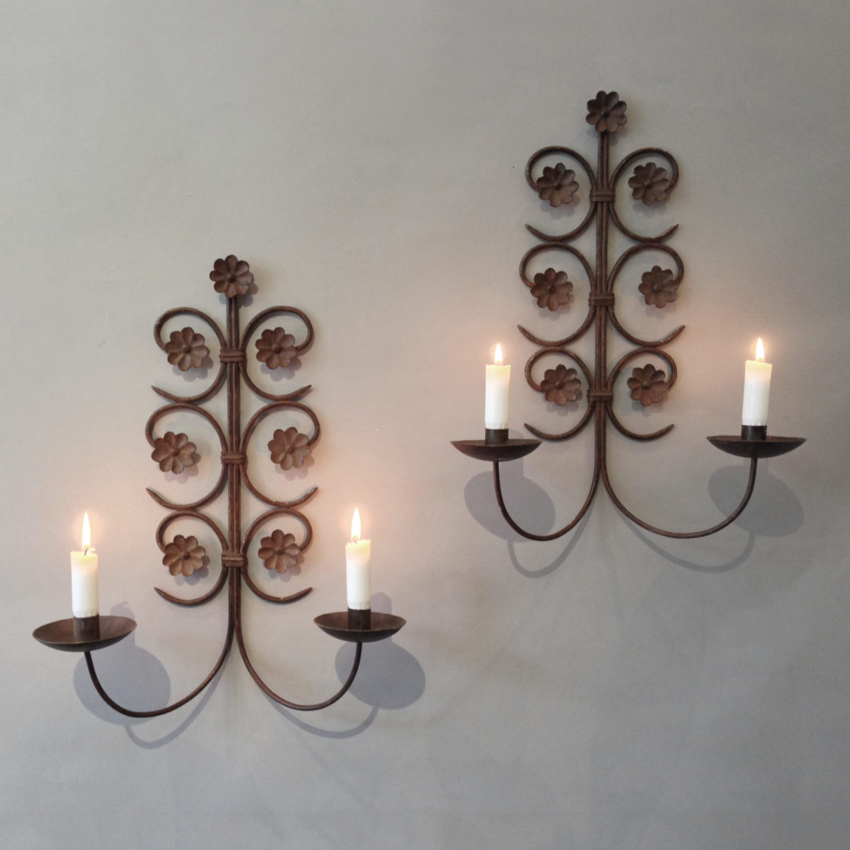 A pair of cheverny scrolling iron wall appliques